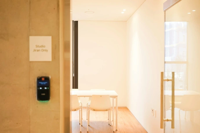 a room with a table and chairs in it